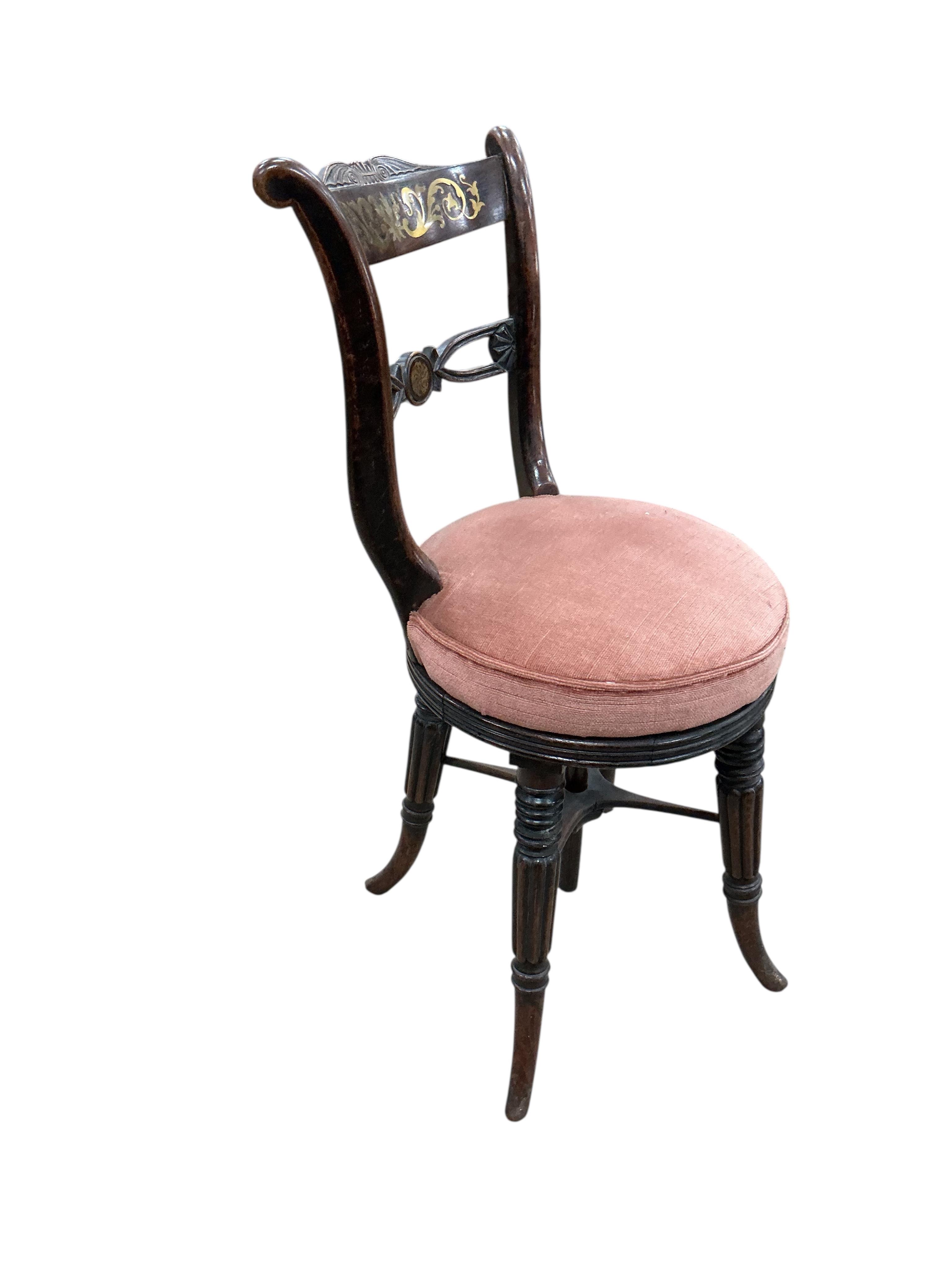 A Regency cut brass inlaid adjustable music stool, width 39cm